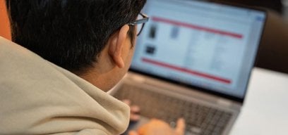 Student using laptop.