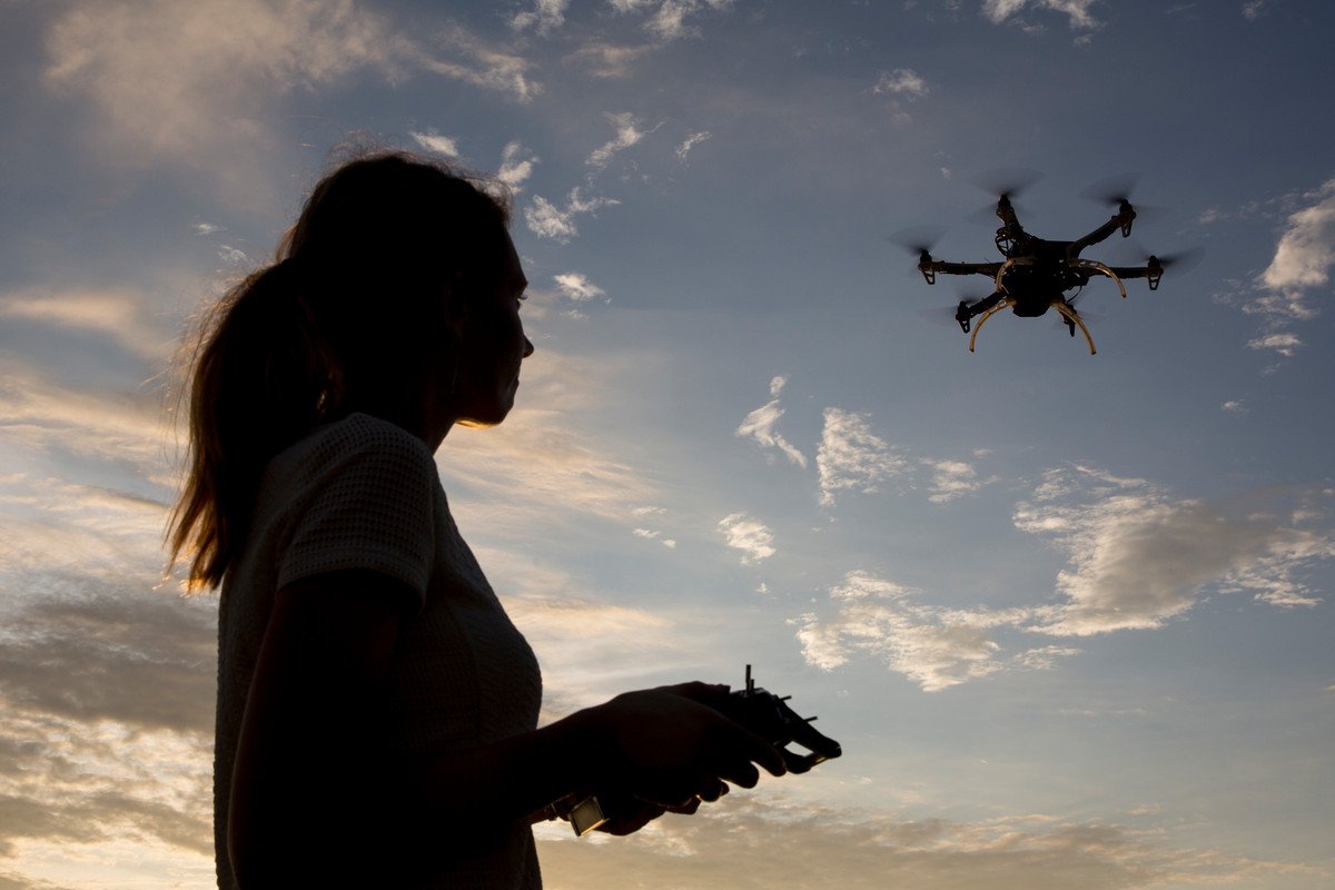 Kimberly Fornace (MONKEYBAR project) controlling the helicopter drone in Sabah, Malaysia. Credit: Joshua Paul/LSHTM