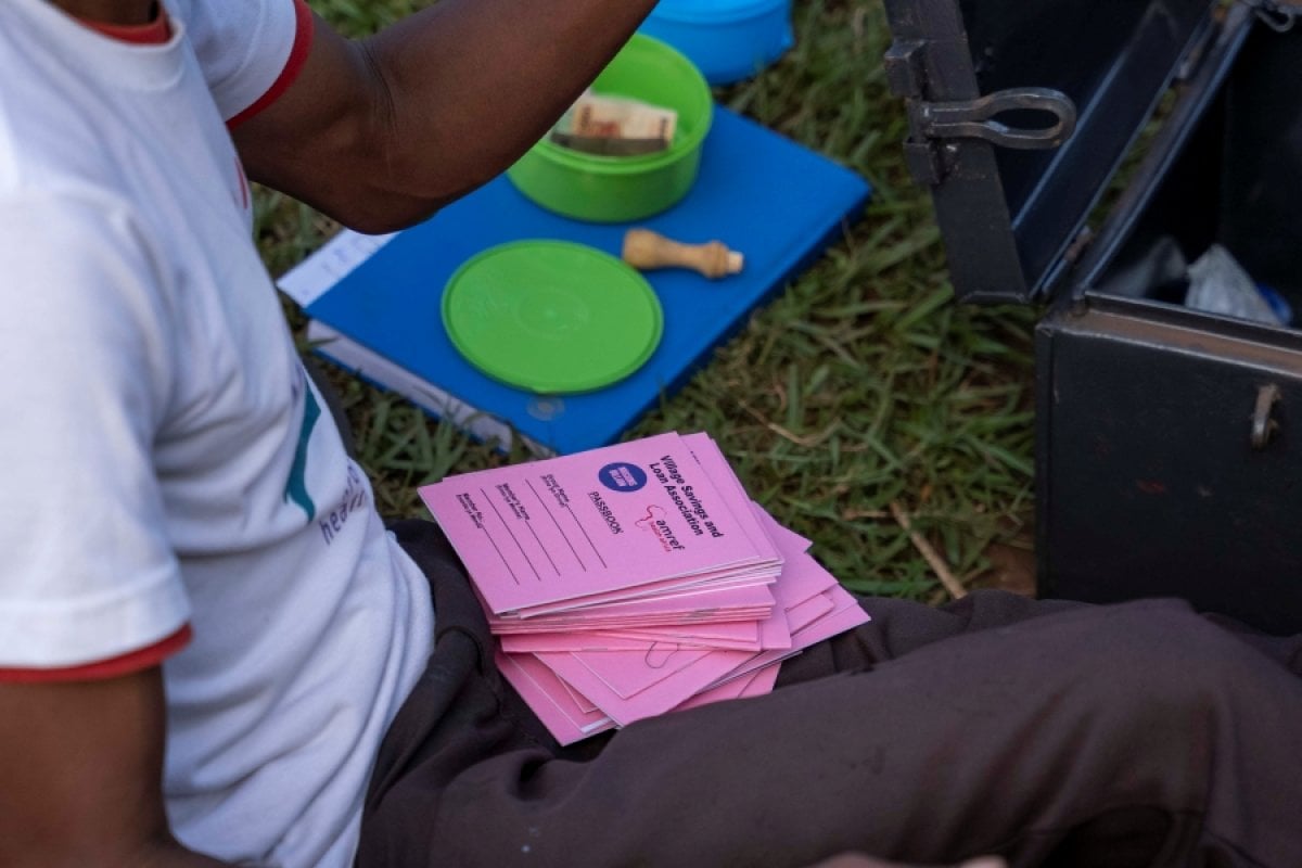 A close-up of the project-supported village savings scheme booklets used by Luuka residents part of the PLA-D groups