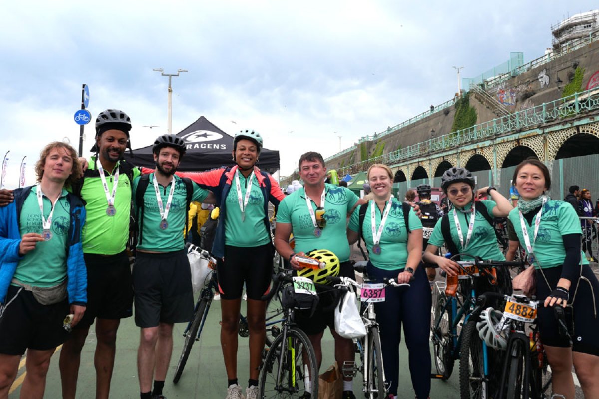Abi and Naima Sakande (2nd and 4th from left) and friends after finishing London to Brighton cycle ride 2024