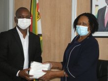 Dr Ndlovu receiving donation