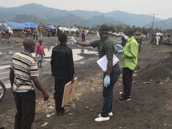 Here, in this August 2019 image, screeners use an infrared thermometer to look for signs of fever in travelers in Mubambiro, near the city of Goma, Democratic Republic of the Congo (DRC). A fever is one of the symptoms of Ebola virus disease, which Congolese and international health agencies have been battling for a year in the DRC.