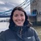 Amanda Fata standing in front of London Bridge.