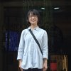 an asian woman in a blue shirt