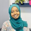 An African woman wearing a blue hijab